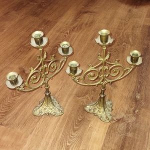 🕍 One pair gold colored antique candelabra